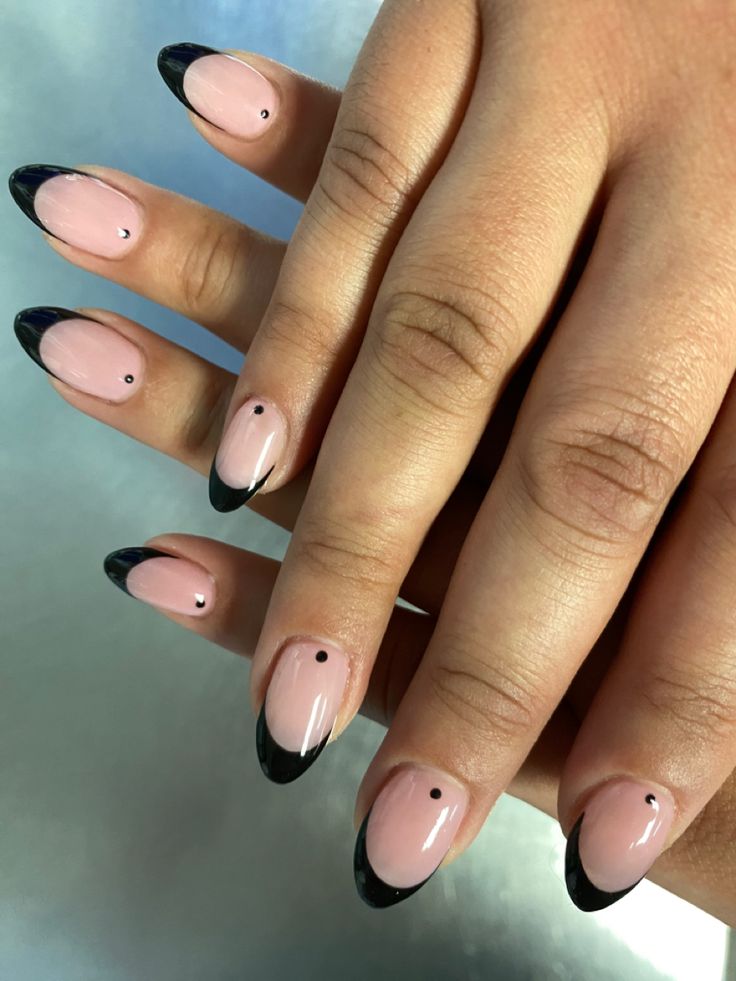 Chic Soft Pink and Black Nail Design with Minimalist Dot Accent