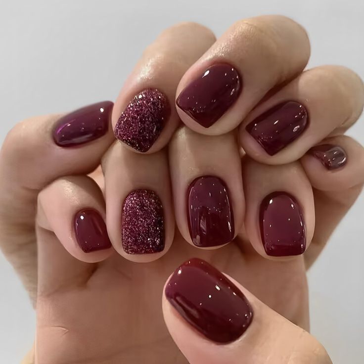 Stunning Elegant Burgundy Nail Design with Solid and Glitter Finishes for Versatile Occasions.