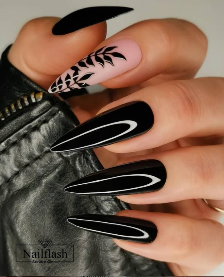 Chic Stiletto Nail Design: Bold Black and Soft Pink with Elegant Floral Accent