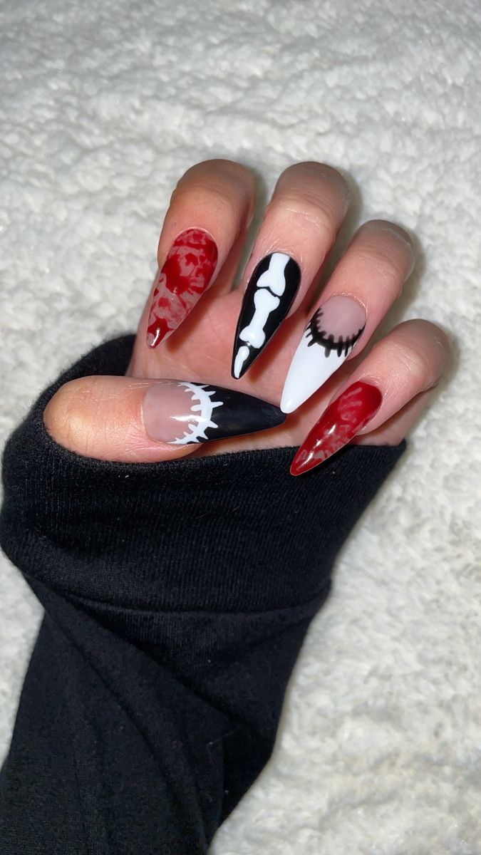 Bold and Edgy Vibrant Nail Design: A Fusion of Graphic Motifs and Striking Colors.