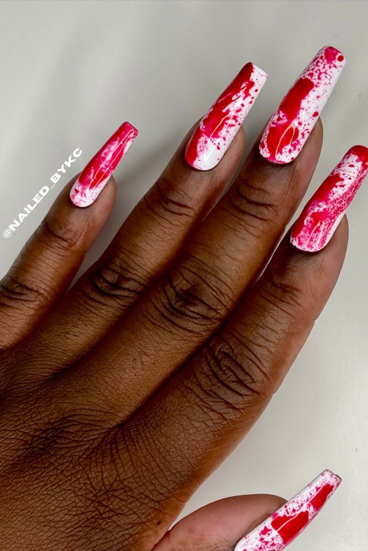 Bold, Artsy Nail Design: Glossy White Base with Striking Red Splatter