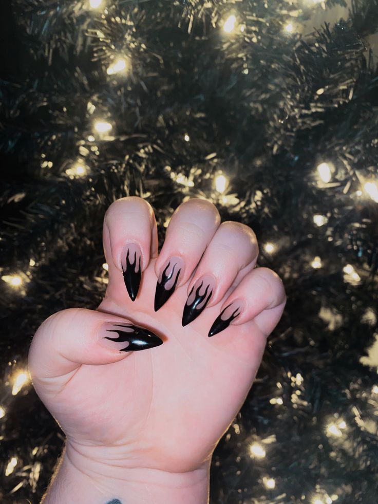 Bold Edgy Nail Design with Sharp Shapes and Dramatic Flame Motif.