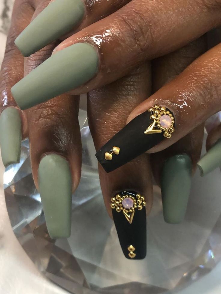 Sophisticated Nail Design: Muted Sage Green with Striking Black and Gold-Pink Accents.