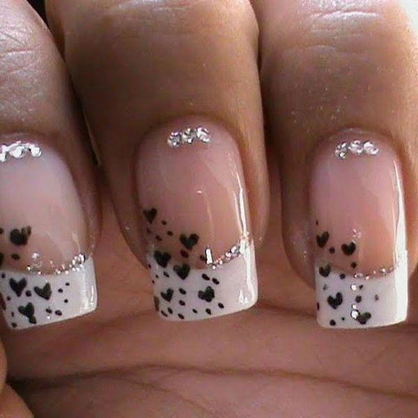 Elegant Heart-Inspired Nail Design with Sparkling Gems and Soft White Tips