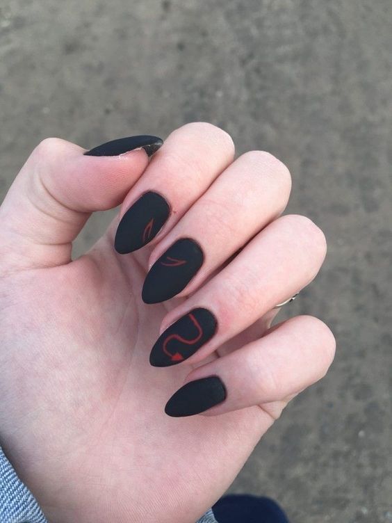 Sophisticated Matte Black Almond Nails with Vibrant Red Accents: A Bold Statement for Any Occasion.