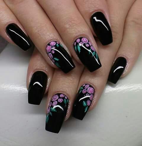 Sophisticated Black Nails Adorned with Playful Floral Designs