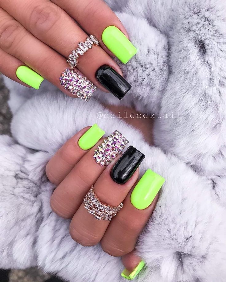 Bold Neon Green and Sleek Black Nail Design Enhanced with Sparkling Rhinestones.