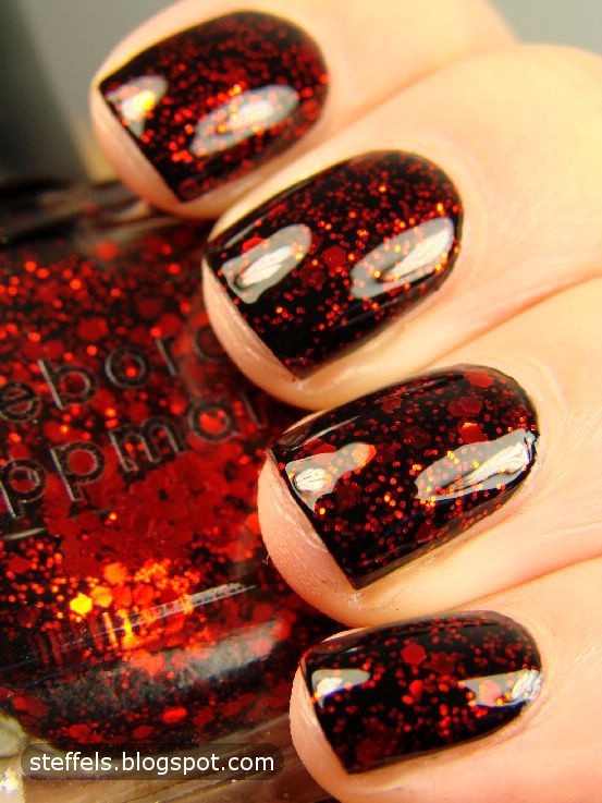 Bold Red and Black Glossy Nail Design: A Striking Statement of Glamour.