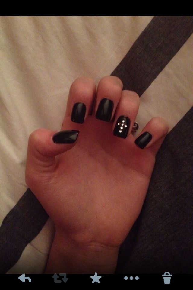 Sophisticated Black Nail Design with Glossy Finish and White Dot Accents