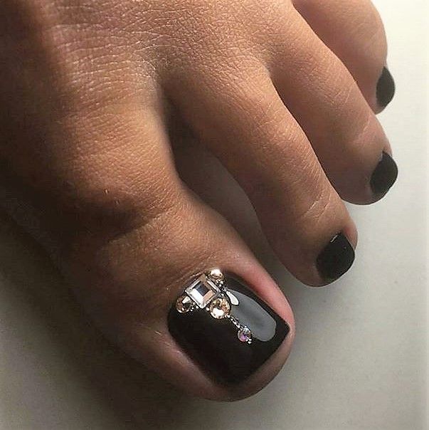 Chic Black Toenails with Rhinestone Elegance and Sophisticated Design.