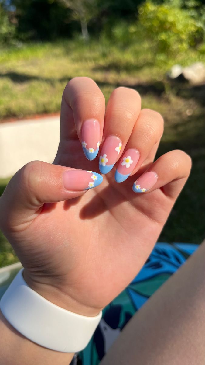 Cheerful Floral Nail Design with Pastel Colors and Delicate White Flowers