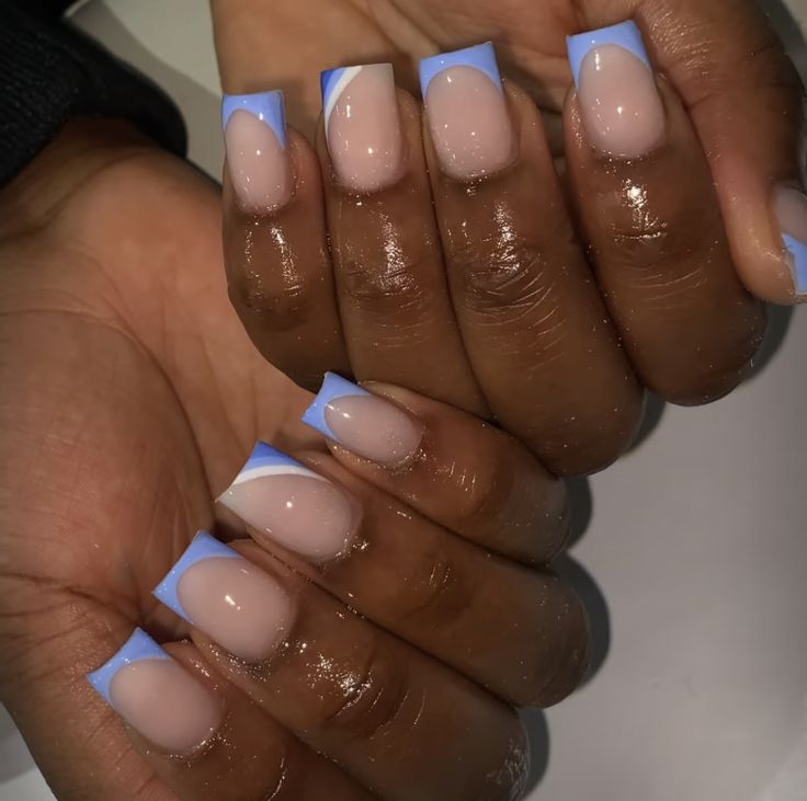 Modern Chic French Manicure: Soft Nude Base with Vibrant Blue Tips.