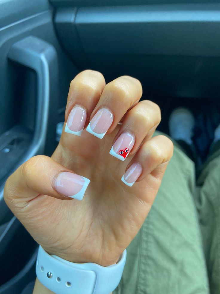 Elegant French Tip Manicure with Playful Accent Nail