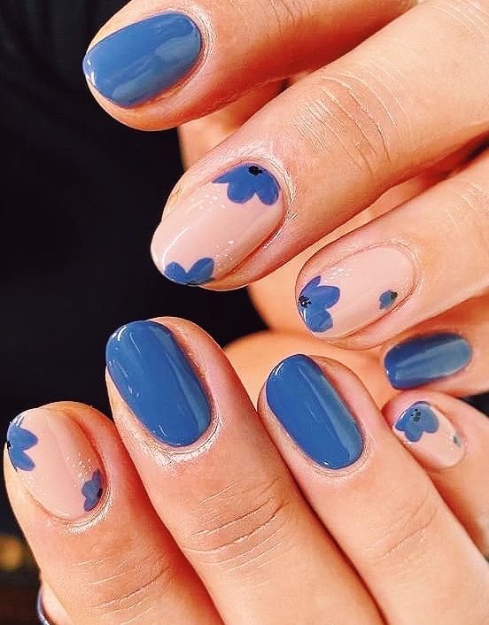 Chic Floral Nail Design with Blue and Nude Tones for Elegant Accents.