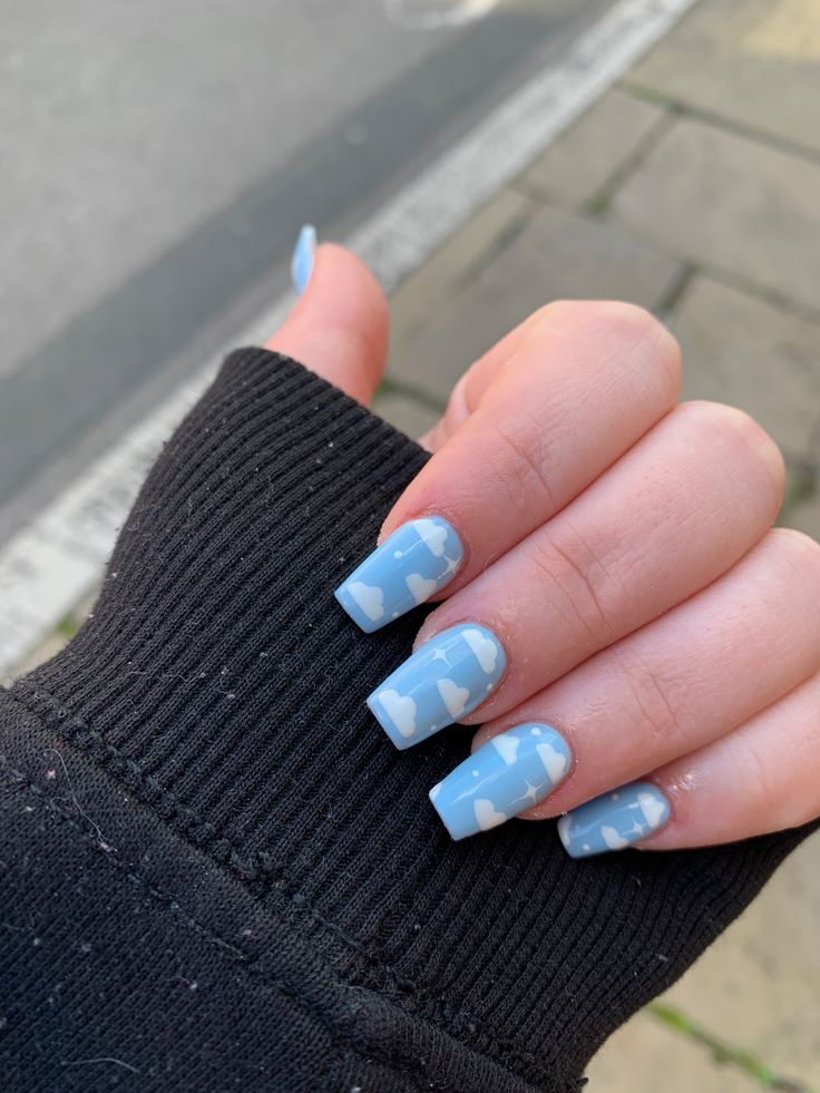 Whimsical Blue Cloud Nail Design for a Fresh, Playful Look.