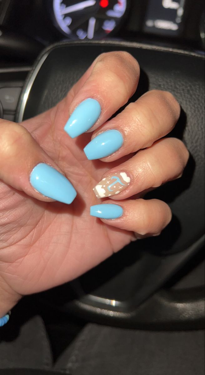 Vibrant Blue Nail Design with Glossy Finish and Artistic Accent Nail.