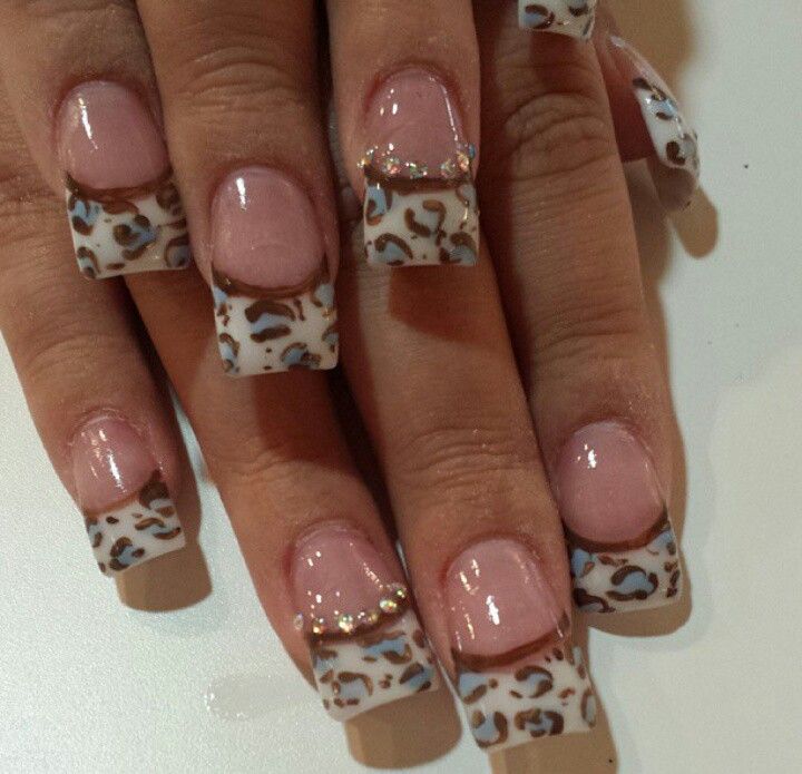 Chic Nude and Leopard Print Nail Design with Glossy Finish and Elegant Accents.