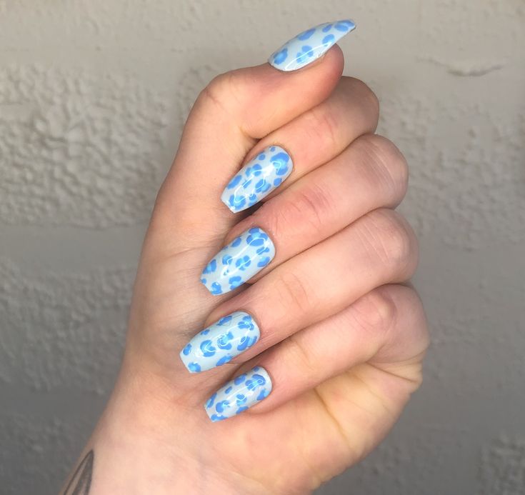 Vibrant Blue Polka Dot Nail Design: A Playful Statement for Your Manicure.