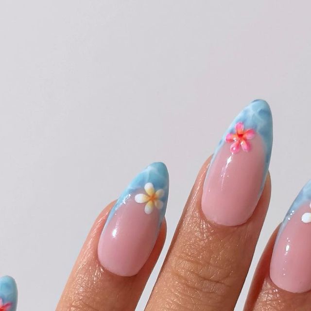 Whimsical Floral Nail Design with Soft Pink Base and Sky-Blue Tips.