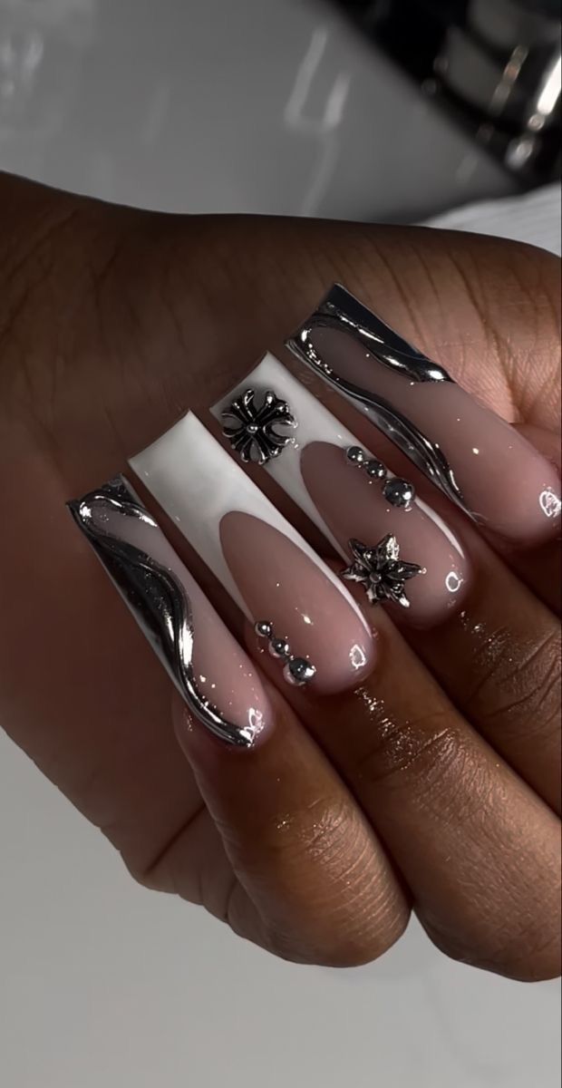 Chic Nail Design: Glossy Beige and Bold Chrome with Unique Textures and Motifs.