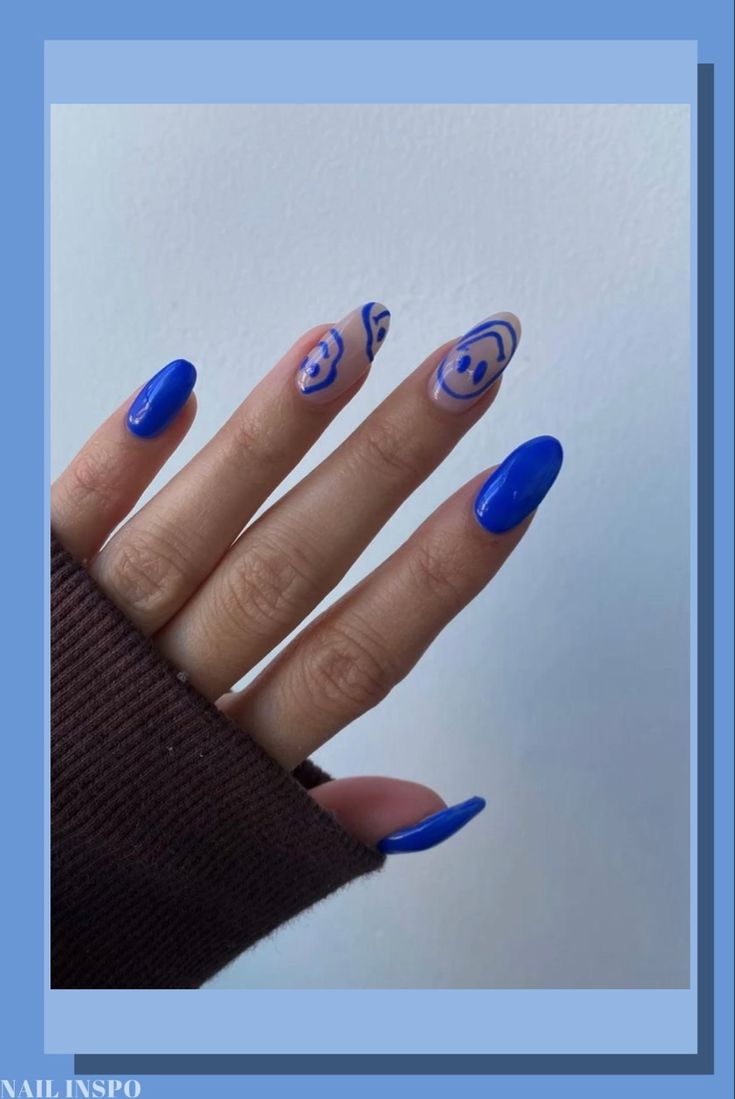 Chic Bold Blue Nail Design with Abstract Patterns and Elegant Swirls