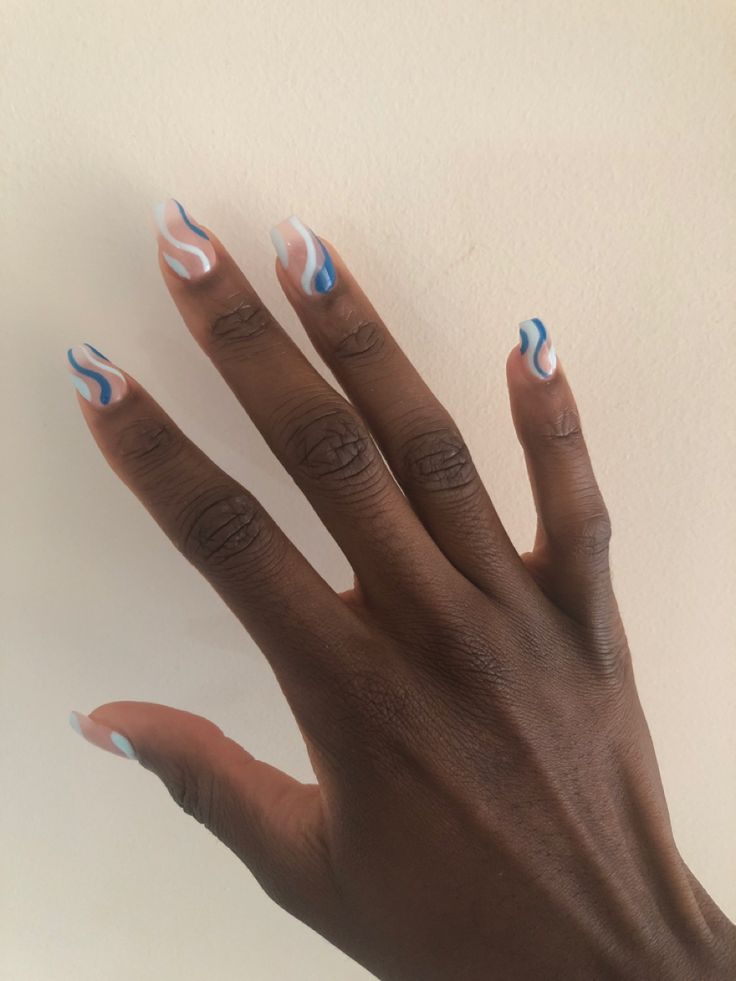 Dynamic Fluid Wave Nail Art in Blue, White, and Soft Pink for Creative Individuality.