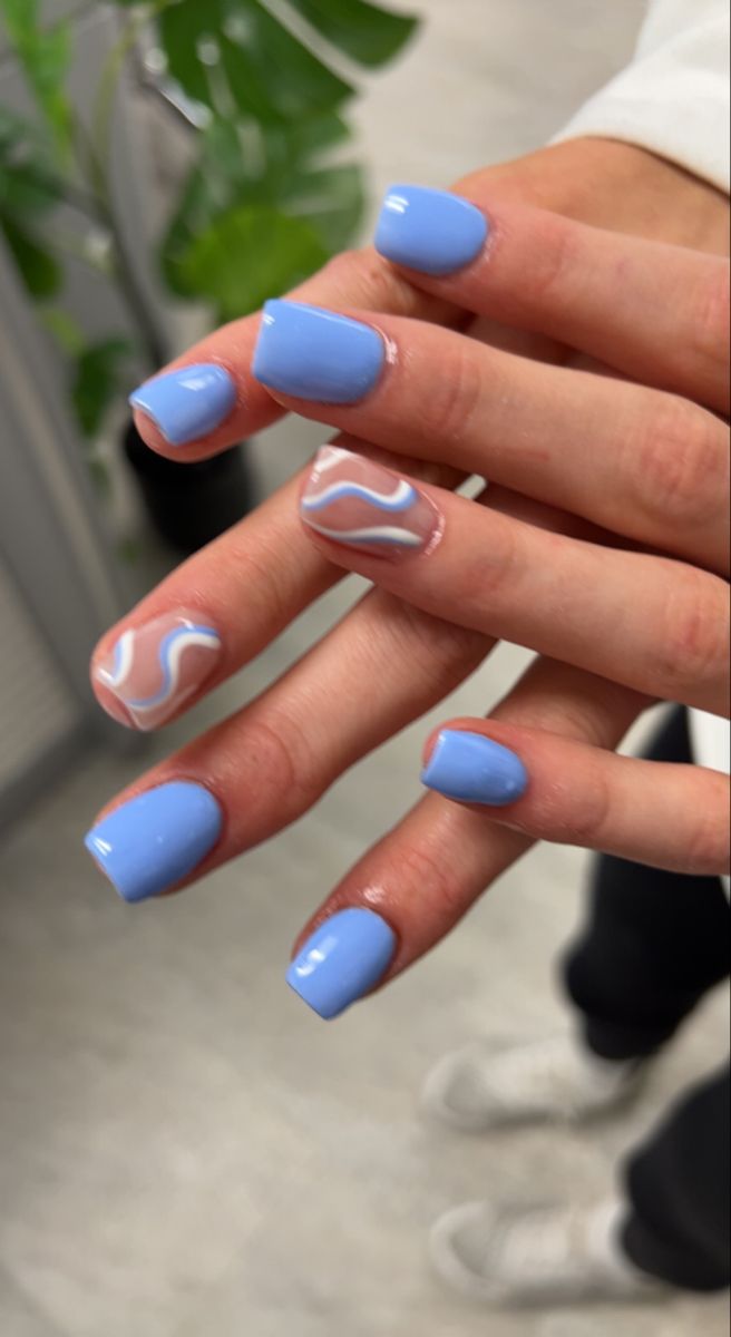 Glossy Vibrant Blue Nail Design with Playful White Patterns