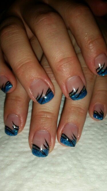 Elegant Sparkling Blue and Black French Tip Nail Design with Glitter Accents.