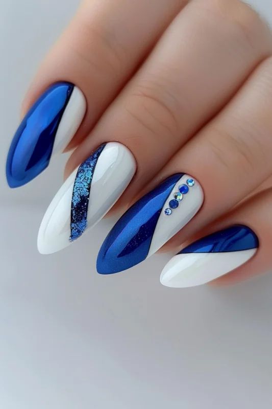 Elegant Modern Nail Design: Deep Blue and Crisp White with Rhinestone Accents