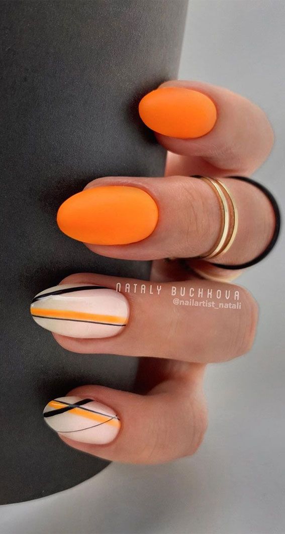 Bold Orange and Minimalist Line Nail Design for a Modern Aesthetic.