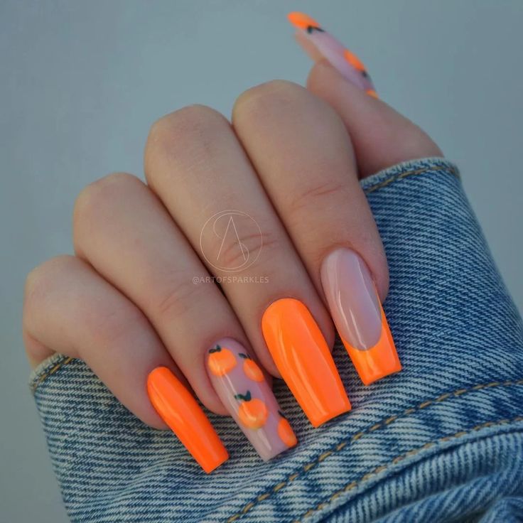 Bold Seasonal Nail Design with Bright Orange and Pumpkin Accents.