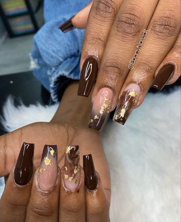 Elegant Nail Design: Deep Brown and Transparent Acrylic with Marbled Effects and Gold Leaf Accents