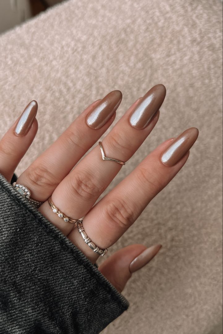 Sophisticated Almond-Shaped Nails with Glossy Copper Finish, Perfect for Any Occasion.