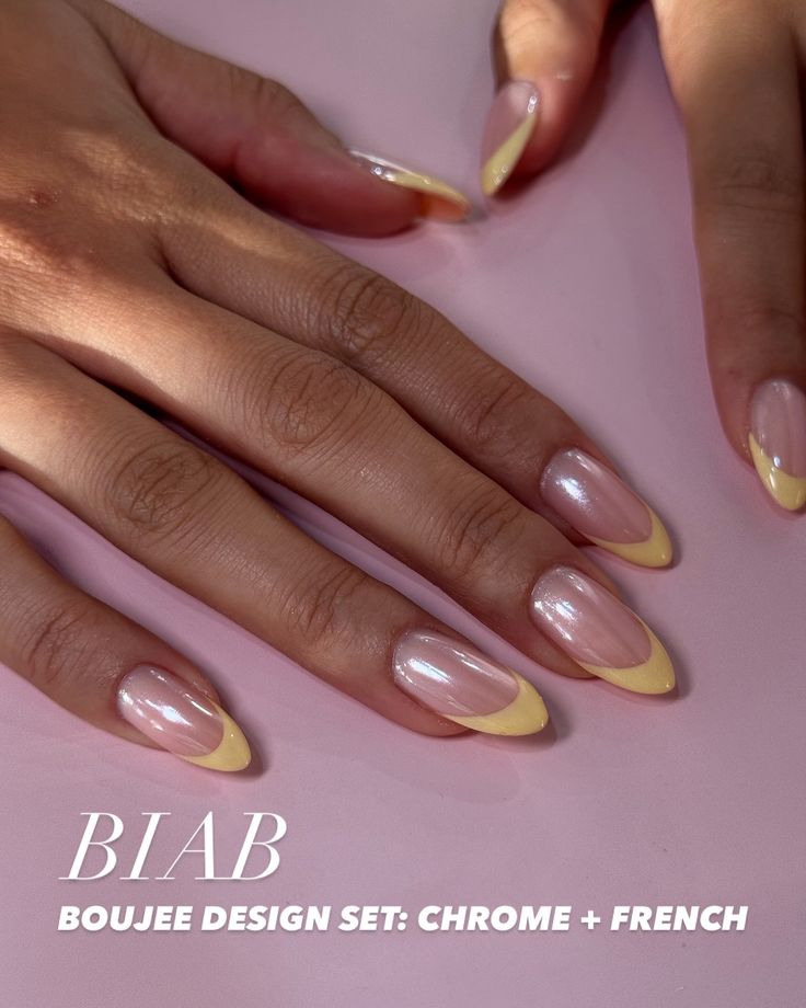 Chic Nude and Yellow French Manicure with Glossy Chrome Finish.