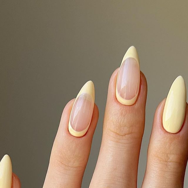 Sophisticated Almond-Shaped Nails in Soft Yellow with Sheer Transparency