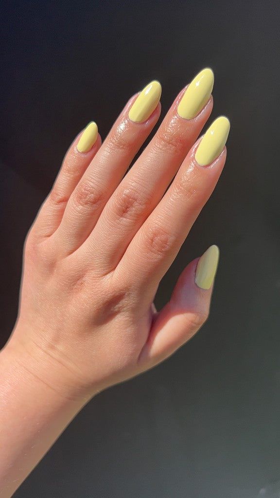 Vibrant Glossy Yellow Almond-Shaped Nails for Any Occasion