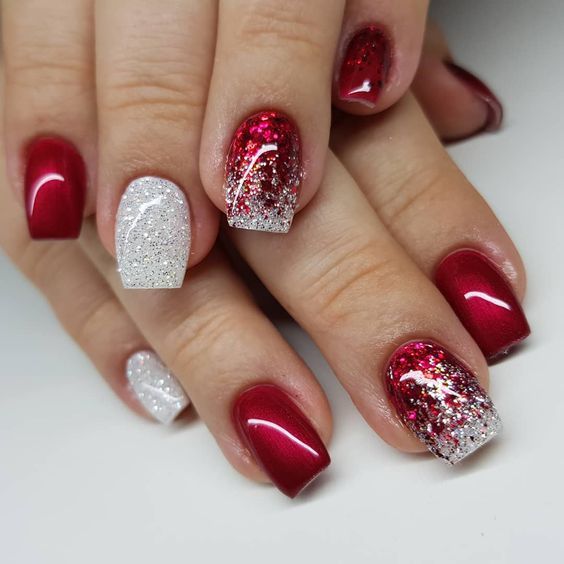 Elegant Red and Silver Nail Design with Glossy and Glitter Gradients for Festive Glamour.