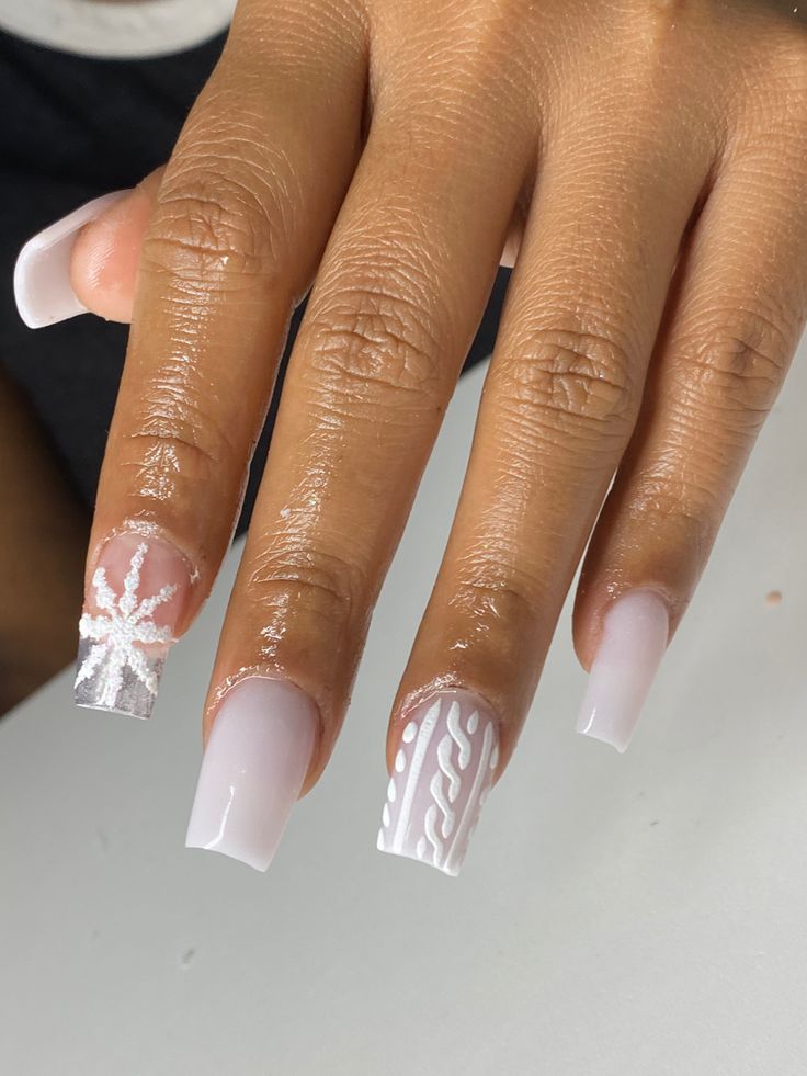 Chic Winter Nail Art: Elegant Snowflake Motif with Metallic Accents