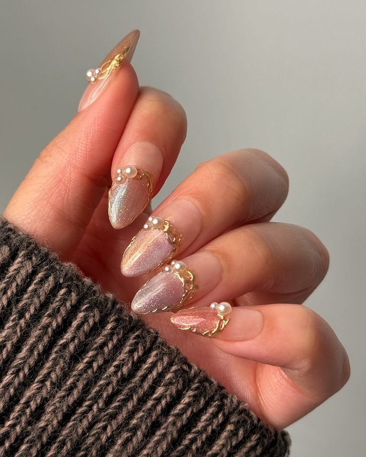 Chic Almond-Shaped Nail Design with Iridescent Finish and Elegant Gold Accents