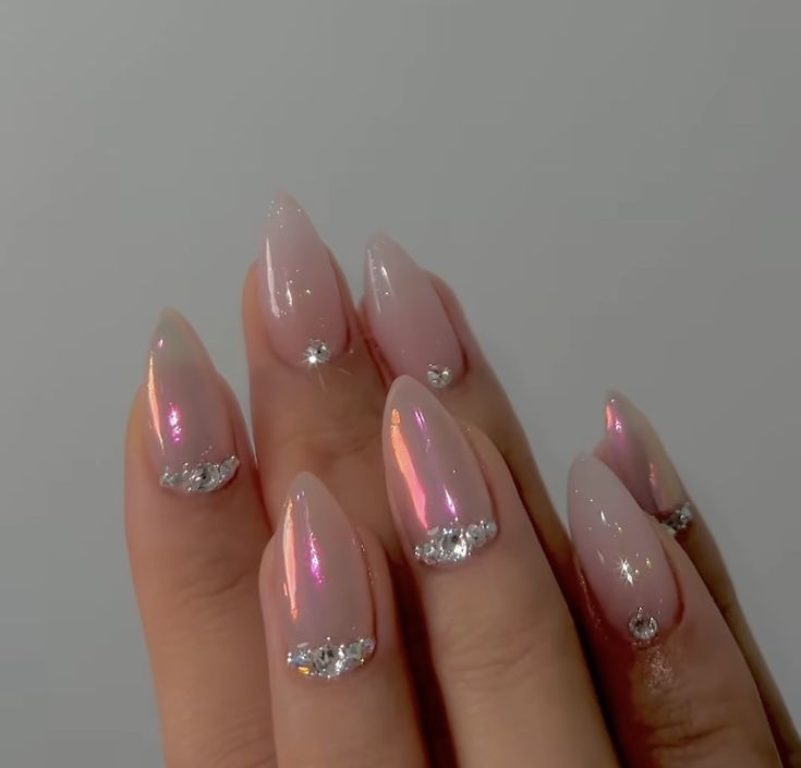 Chic Pink Gradient Nail Design with Glossy Finish and Gem Accents.