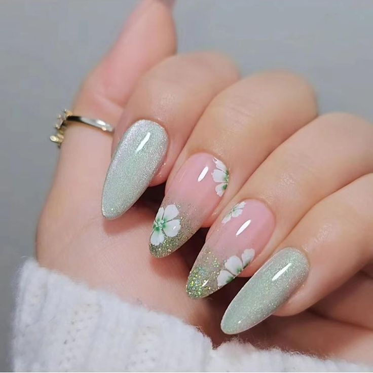 Elegant Floral Nail Art: Soft Pink and Shimmering Green Design for Spring Sophistication.