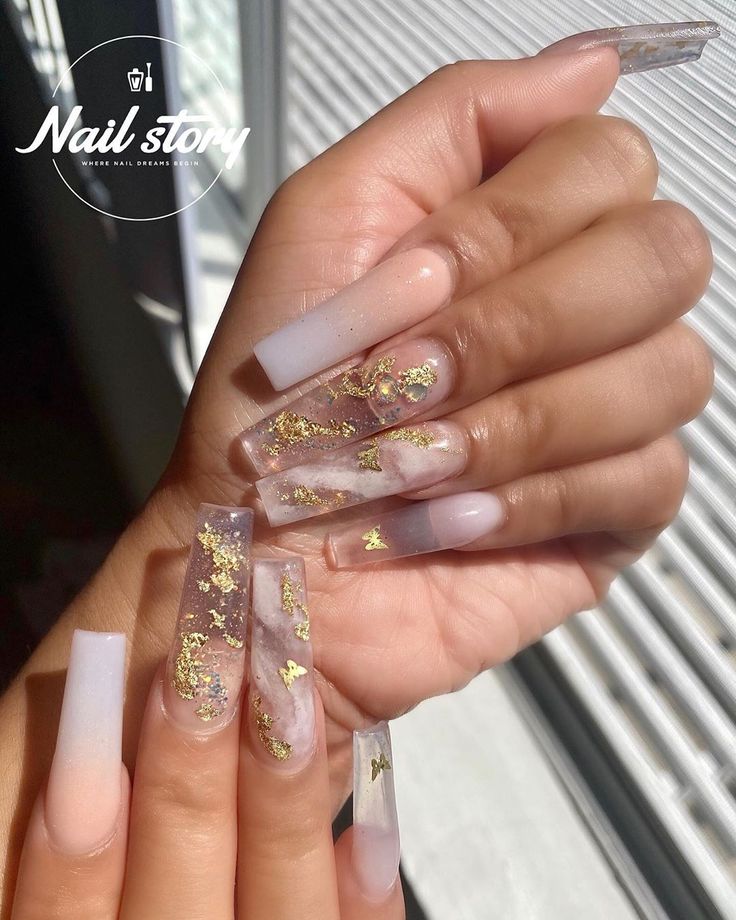 Sophisticated Nail Design with Ombre Tips and Gold Flakes