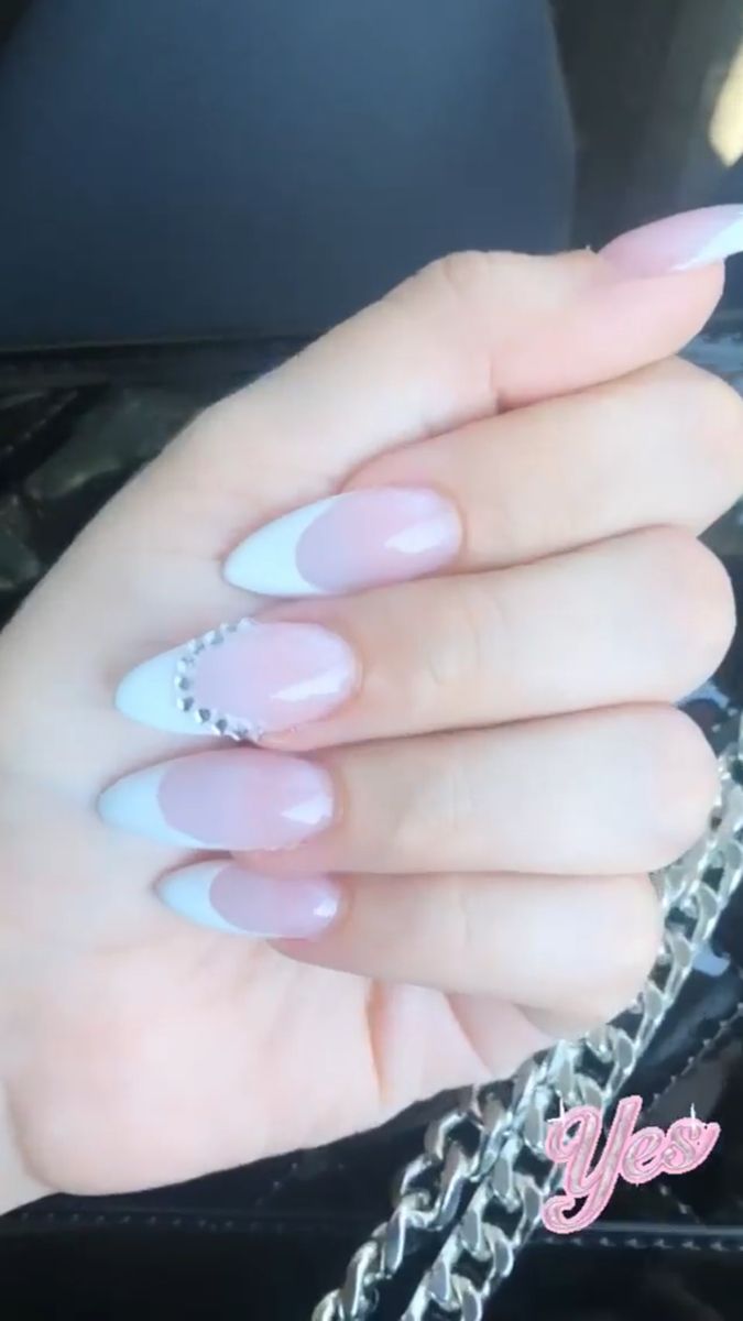 Sophisticated Playful French Tip Nail Design with Rhinestone Embellishments in Soft Pink and White.