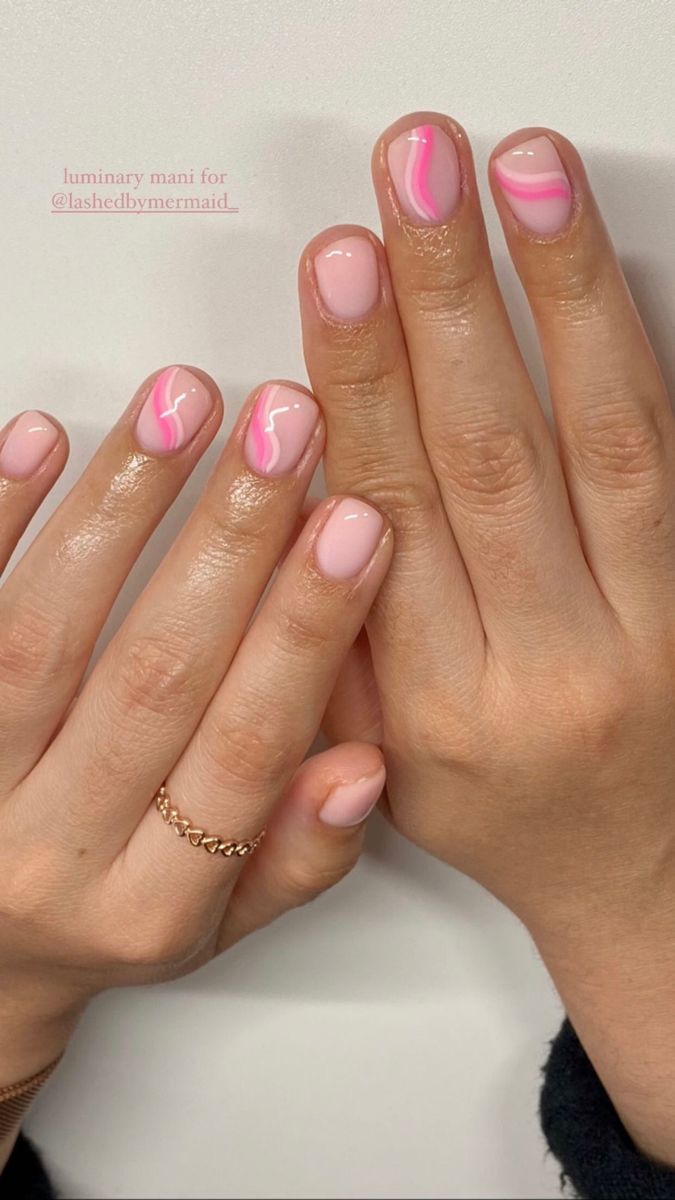 Elegant Soft Pink Nail Design with Playful Vibrant Wavy Lines.