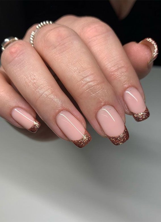 Chic Nude Nail Design with Glitter Tips: A Modern Take on the Classic French Manicure