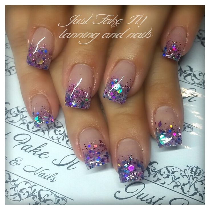 Stunning Ombre Acrylic Nails with Vibrant Purple Tips and Glitter Accents.