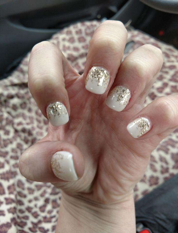 Chic White and Gold Glitter Gradient Nail Design: Sophistication Meets Playful Elegance.