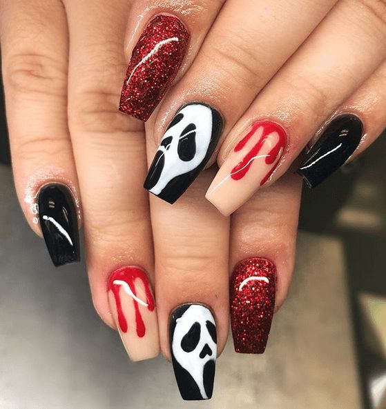 Spooky Halloween Nail Design with Black, Red, and Glittery Ghost Patterns.