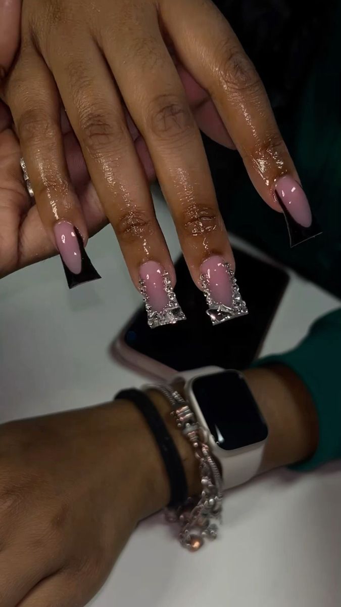 Sophisticated Elegant Nail Design: Soft Pink with Shimmering Silver Accents and Glamorous Embellishments.