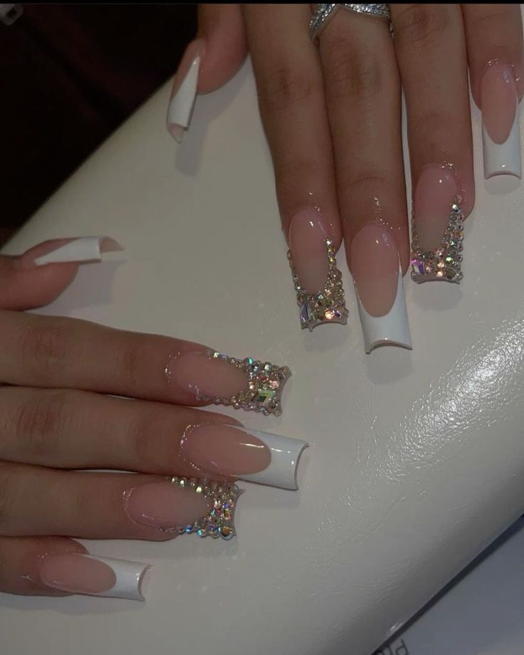 Chic French Tip Nail Design with Nude and White Polish Enhanced by Glamorous Rhinestones